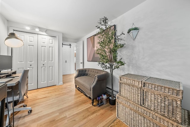 607 1st St Unit 1, Hoboken, NJ 07030 - office space featuring light wood-style floors and a baseboard heating unit