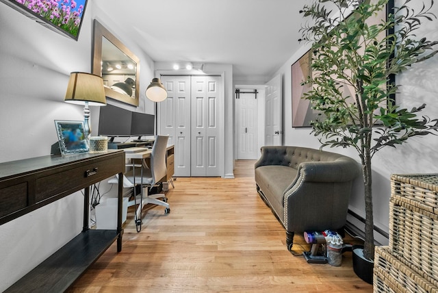 607 1st St Unit 1, Hoboken, NJ 07030 - home office featuring light wood-type flooring and a baseboard radiator