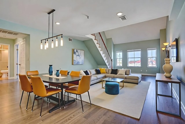 54 Polk St, Newark, NJ 07105 - dining space with wood finished floors, stairway, and recessed lighting
