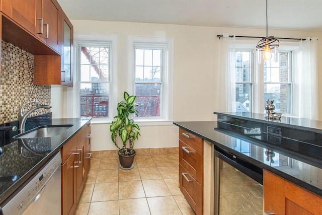 kitchen featuring sink, dishwasher, plenty of natural light, decorative backsplash, and beverage cooler