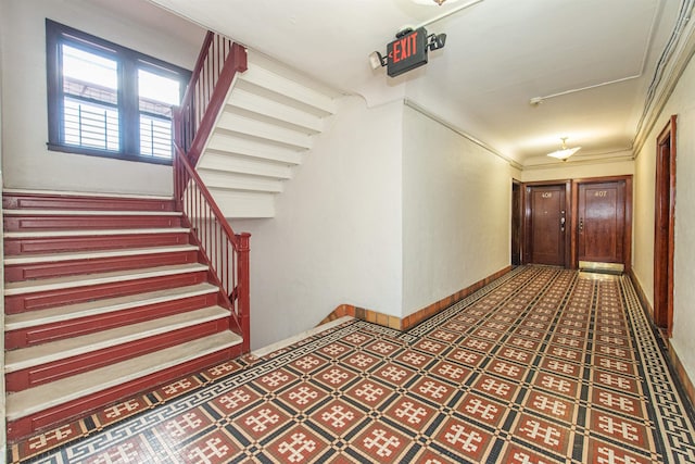 hallway featuring ornamental molding