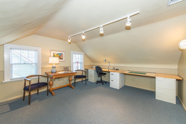 home office with dark colored carpet, visible vents, track lighting, and vaulted ceiling