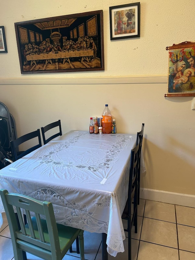 dining room with tile patterned flooring