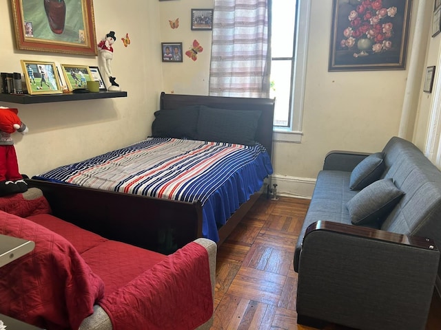 bedroom featuring dark parquet floors