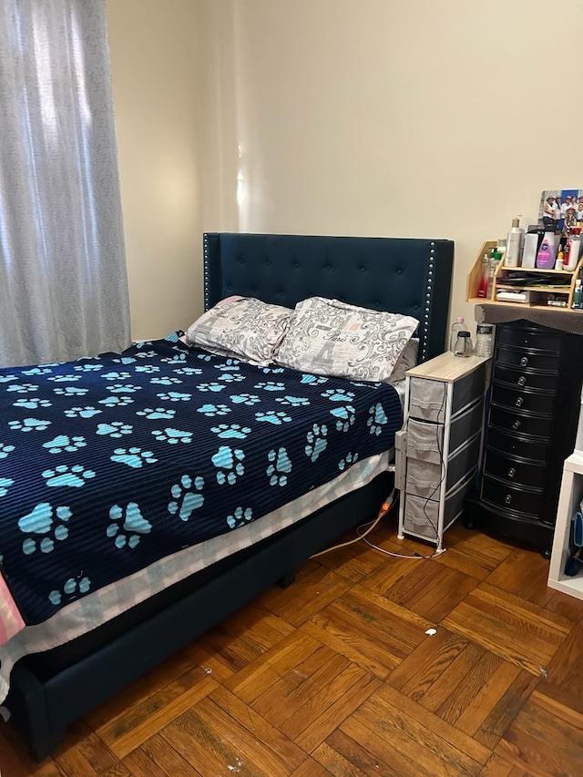 bedroom featuring dark parquet floors