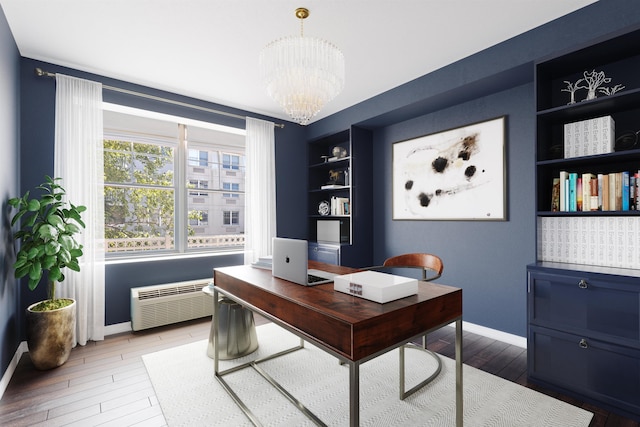 15 Enterprise Ct Unit 211, Jersey City, NJ 07305 - home office with an inviting chandelier, hardwood / wood-style flooring, built in features, and baseboards