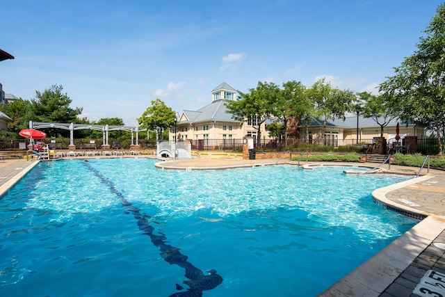 15 Enterprise Ct Unit 211, Jersey City, NJ 07305 - pool with fence, a pergola, and a jacuzzi