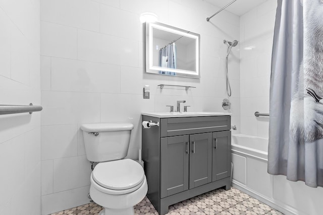 bathroom with tile walls, toilet, tile patterned floors, shower / bath combination with curtain, and vanity