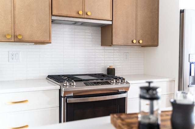 kitchen featuring backsplash and stainless steel appliances