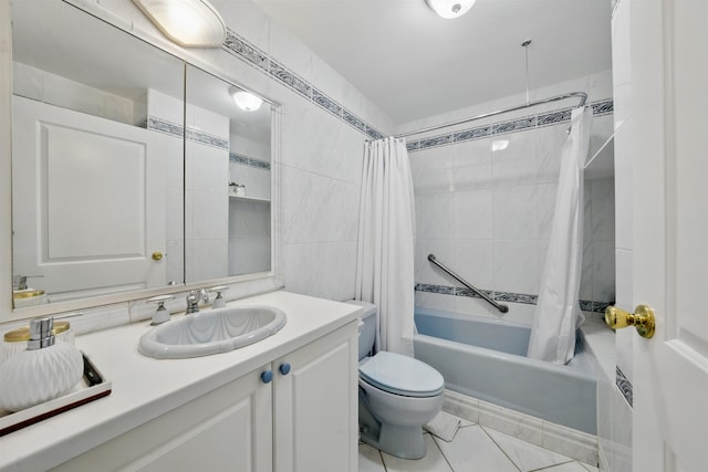 bathroom with shower / tub combo, vanity, toilet, and tile walls