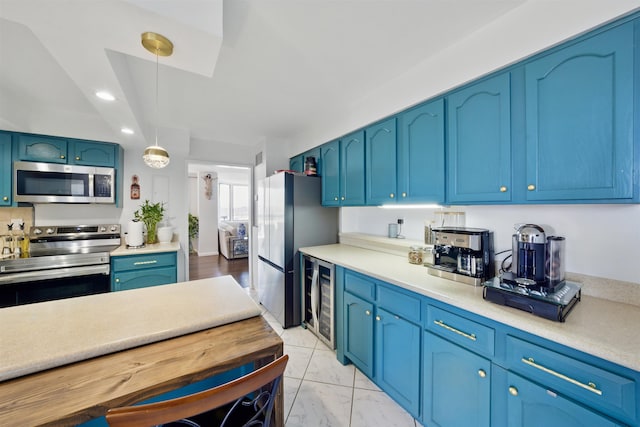 kitchen with marble finish floor, beverage cooler, stainless steel appliances, and light countertops