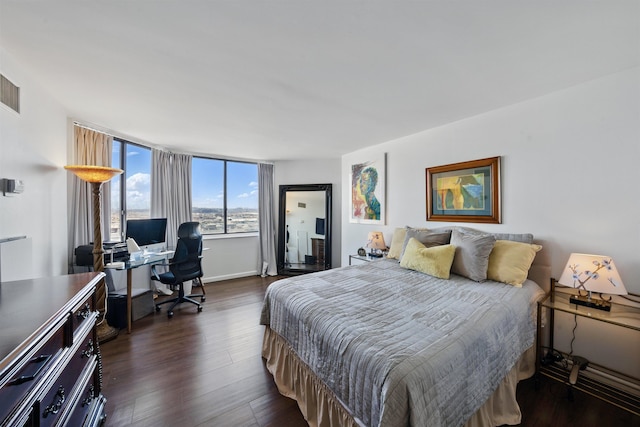 bedroom featuring dark wood-type flooring