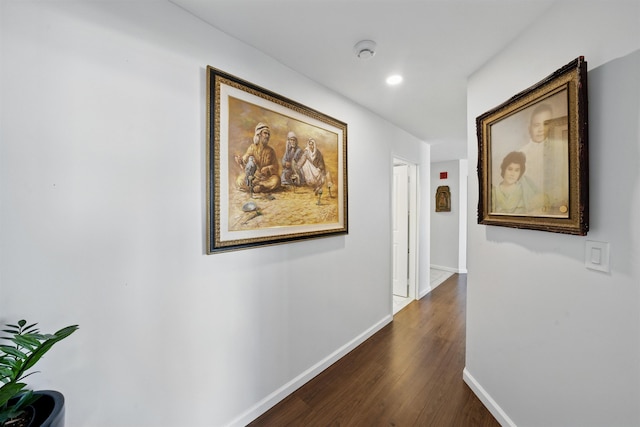 hall with baseboards, dark wood-style flooring, and recessed lighting