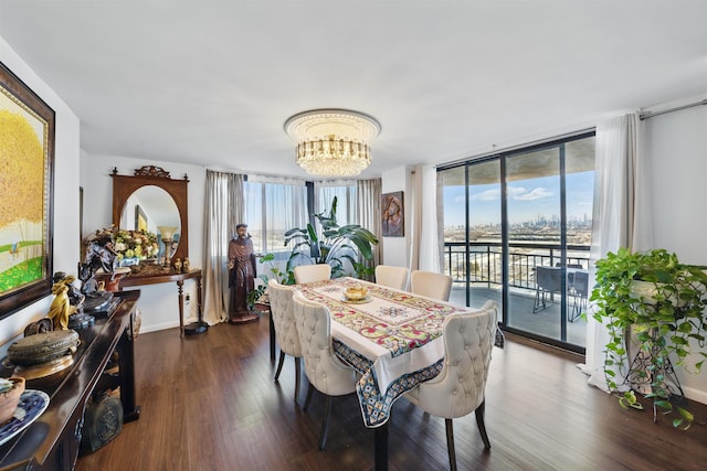 dining space with a wall of windows, a notable chandelier, dark wood finished floors, and baseboards