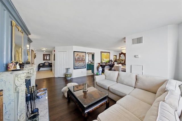 living area featuring dark wood finished floors and visible vents