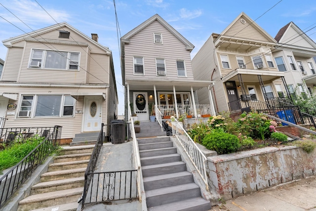 26 E 49th St, Bayonne, NJ 07002 - view of front of home featuring a porch and stairway