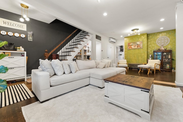 26 E 49th St, Bayonne, NJ 07002 - living area featuring a wall unit AC, stairs, wallpapered walls, recessed lighting, and an accent wall