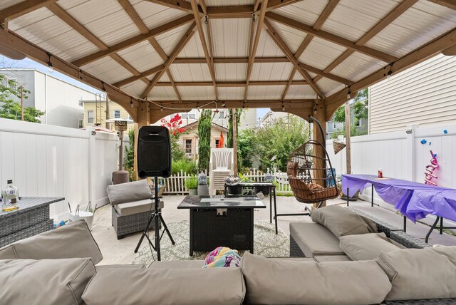 26 E 49th St, Bayonne, NJ 07002 - fenced backyard with an outdoor hangout area, a gazebo, and a patio area