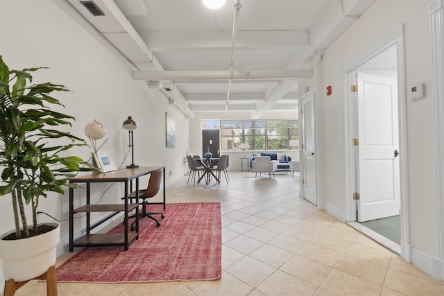 300 Communipaw Ave Unit 17, Jersey City, NJ 07304 - hall with light tile patterned flooring, beam ceiling, and baseboards