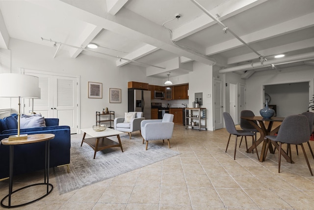 300 Communipaw Ave Unit 17, Jersey City, NJ 07304 - living area featuring beamed ceiling and light tile patterned floors