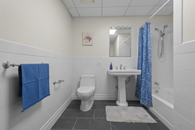 300 Communipaw Ave Unit 17, Jersey City, NJ 07304 - bathroom featuring toilet, a drop ceiling, tile patterned floors, shower / tub combo, and tile walls