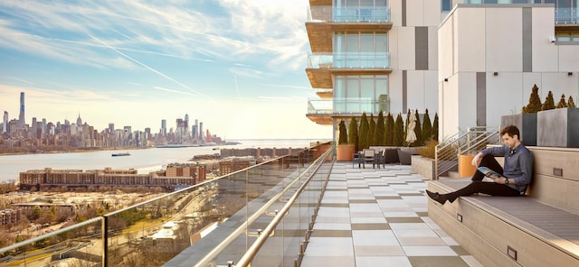 320 Adolphus Ave Unit 321-A, Cliffside Park, NJ 07010 - balcony featuring a skyline view, a water view, and an outdoor living space