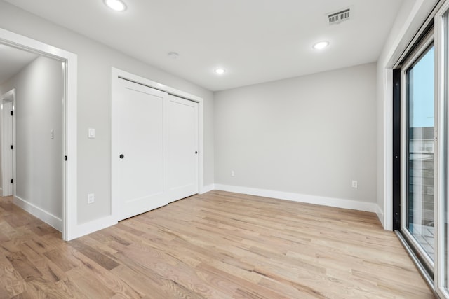 27 E 16th St Unit 2, Bayonne, NJ 07002 - unfurnished bedroom featuring light wood-style flooring, recessed lighting, and a closet