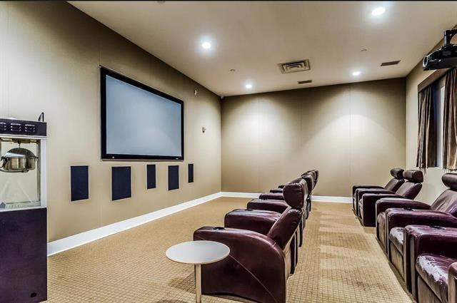 cinema room featuring recessed lighting, baseboards, visible vents, and light colored carpet