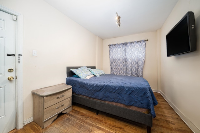 bedroom featuring dark wood-type flooring