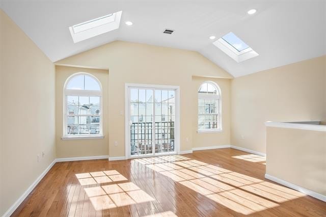 interior space featuring light wood-type flooring and lofted ceiling