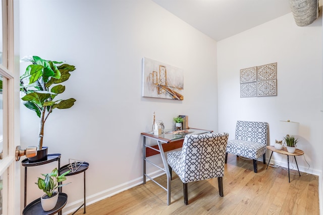 home office with light hardwood / wood-style floors