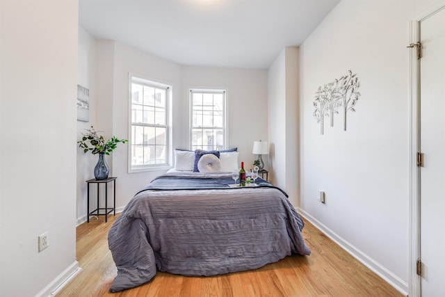 bedroom with light hardwood / wood-style flooring