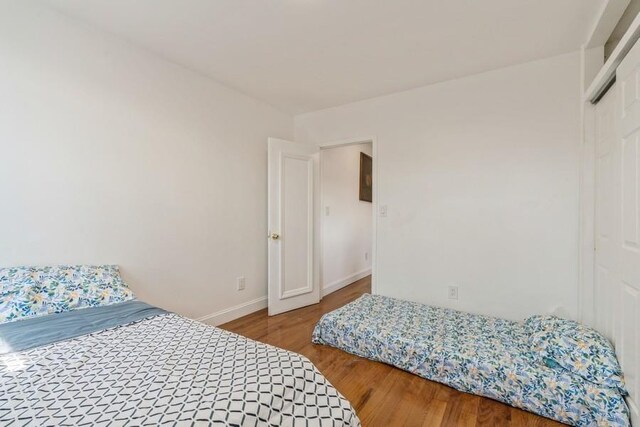 527 Kennedy Blvd, Bayonne, NJ 07002 - bedroom featuring baseboards and wood finished floors