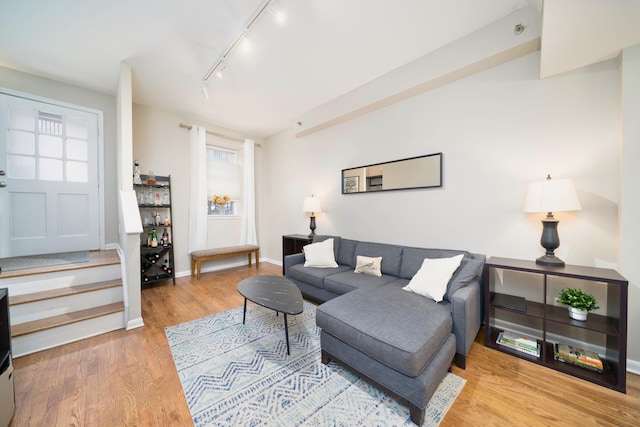 186 Wayne St Unit D-106, Jersey City, NJ 07302 - living room with track lighting, wood finished floors, and baseboards