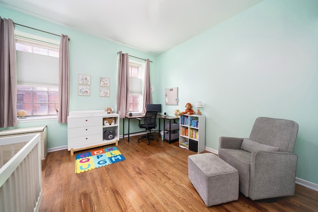 186 Wayne St Unit D-106, Jersey City, NJ 07302 - office area with wood finished floors, healthy amount of natural light, baseboards, and radiator heating unit