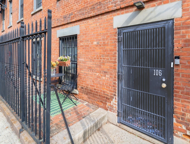 186 Wayne St Unit D-106, Jersey City, NJ 07302 - view of exterior entry featuring brick siding