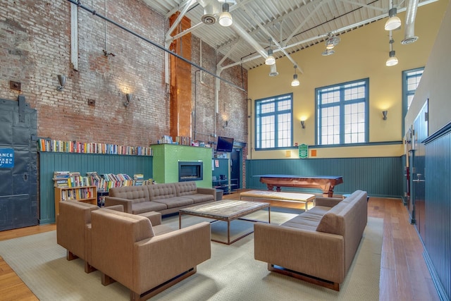 186 Wayne St Unit D-106, Jersey City, NJ 07302 - common area featuring a towering ceiling, a wainscoted wall, and brick wall