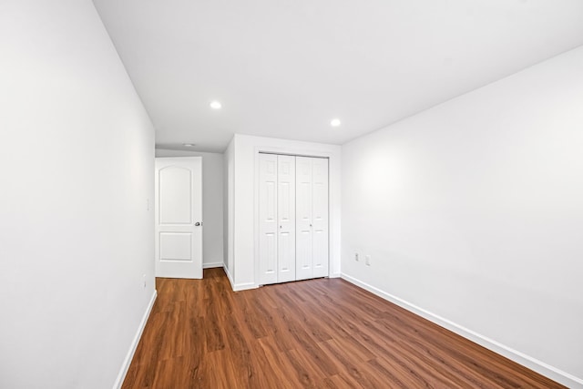 127 Jane St, Weehawken, NJ 07086 - unfurnished bedroom featuring baseboards, wood finished floors, recessed lighting, and a closet