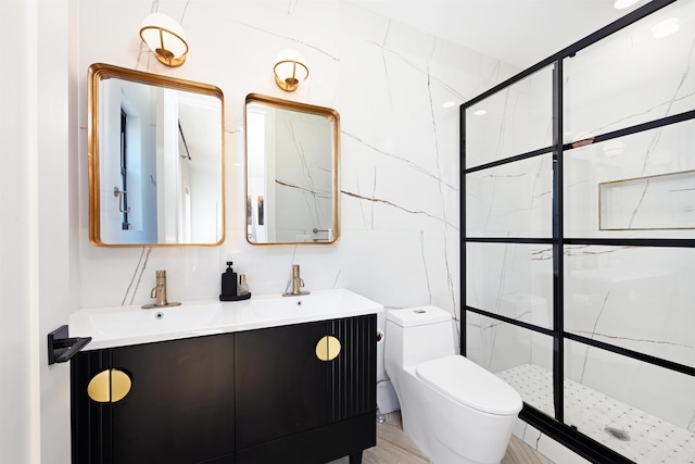 77 Clerk St Unit 1, Jersey City, NJ 07305 - full bathroom featuring a marble finish shower, toilet, and double vanity