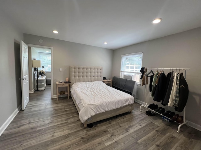 bedroom featuring dark hardwood / wood-style flooring