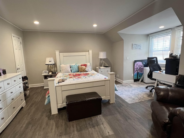 bedroom featuring vaulted ceiling, crown molding, and dark hardwood / wood-style floors