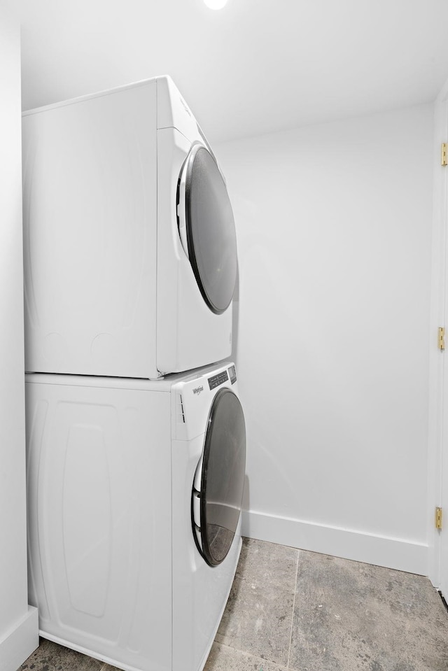 322 3rd St Unit 3, Jersey City, NJ 07302 - laundry room with stacked washer / drying machine and baseboards