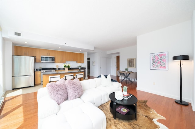 1 Shore Ln Unit 1208, Jersey City, NJ 07310 - living area featuring light wood finished floors and recessed lighting