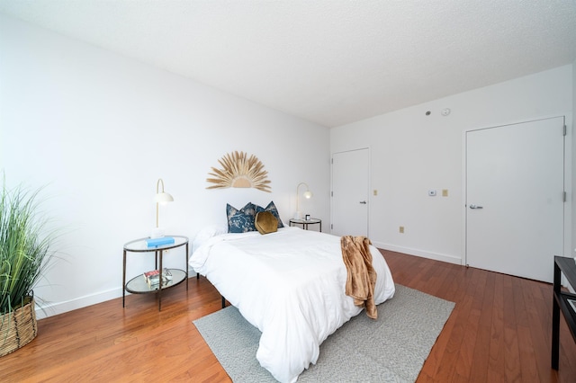 1 Shore Ln Unit 1208, Jersey City, NJ 07310 - bedroom featuring wood finished floors and baseboards
