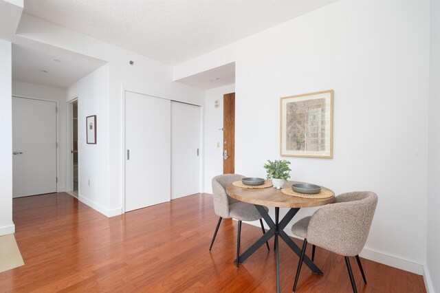 1 Shore Ln Unit 1208, Jersey City, NJ 07310 - dining space featuring wood finished floors and baseboards