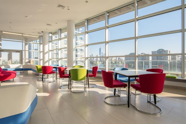 1 Shore Ln Unit 1208, Jersey City, NJ 07310 - community lobby with expansive windows, a city view, and a towering ceiling