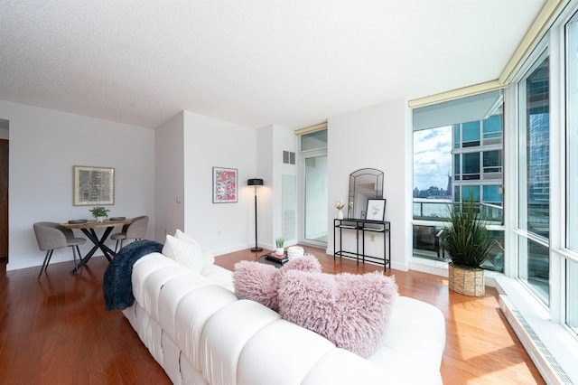1 Shore Ln Unit 1208, Jersey City, NJ 07310 - living area featuring wood finished floors and baseboards