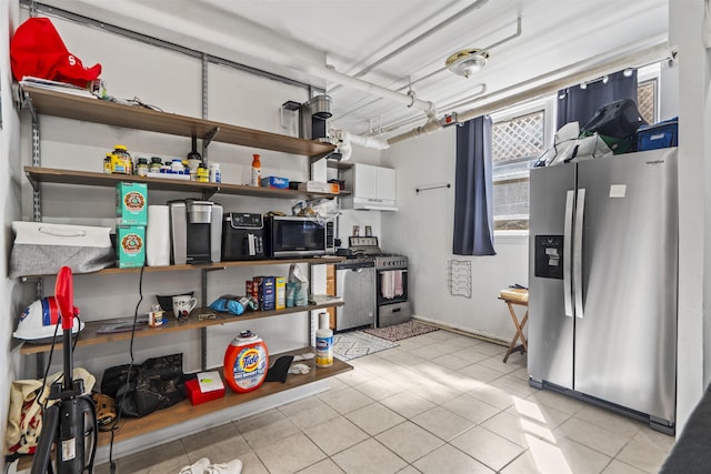 2615 John F Kennedy Blvd Unit B2, Jersey City, NJ 07306 - kitchen featuring appliances with stainless steel finishes, open shelves, white cabinets, and light tile patterned flooring