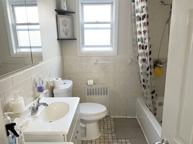 304 51st St, West New York, NJ 07093 - full bath featuring radiator, tile patterned flooring, vanity, tile walls, and shower / bathtub combination with curtain