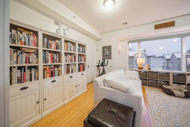 sitting room featuring light hardwood / wood-style flooring